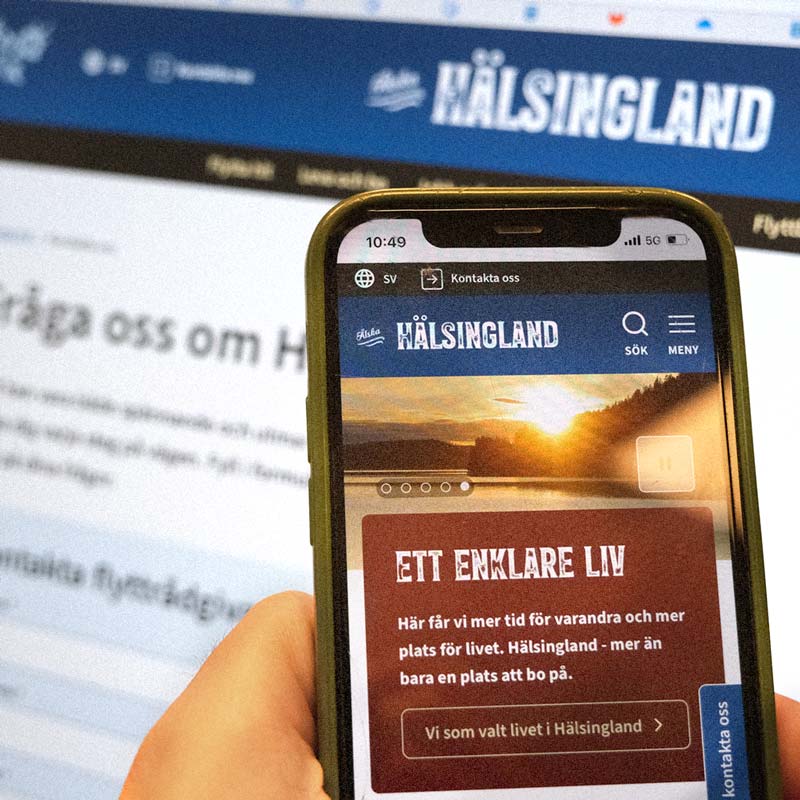 Webbplatsen Hälsingland.se på mobiltelefon och datorskärm